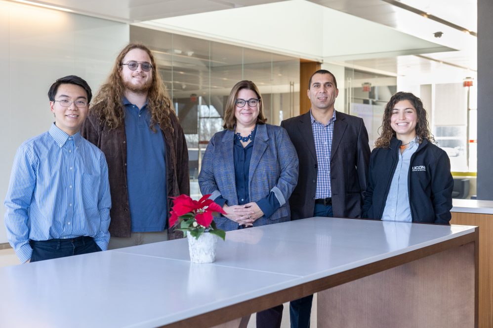 photo of From left, SmartBuildings CT program members Andre Jin, Eric Venables, Amy Thompson, Mohammed Albayati and Julia DeOliveira pose for a photo in the Innovation Partnership Building at UConn Tech Park on Dec. 9, 2022. (Sydney Herdle/UConn Photo)